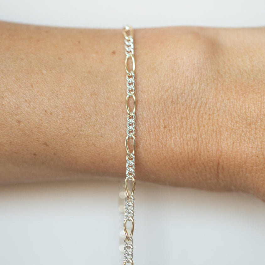 Mixed Metals Figaro Chain. Priced per inch.