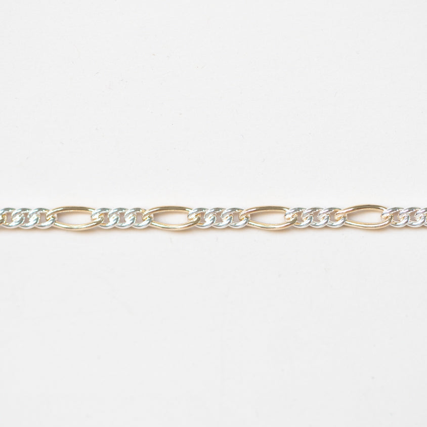 Mixed Metals Figaro Chain. Priced per inch.